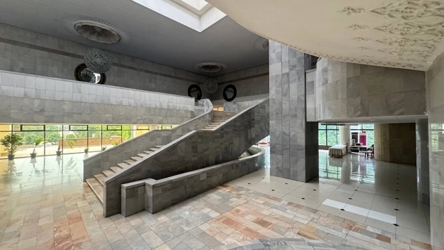 The marble main hall and broad staircase of the Palace of Aircraft Builders